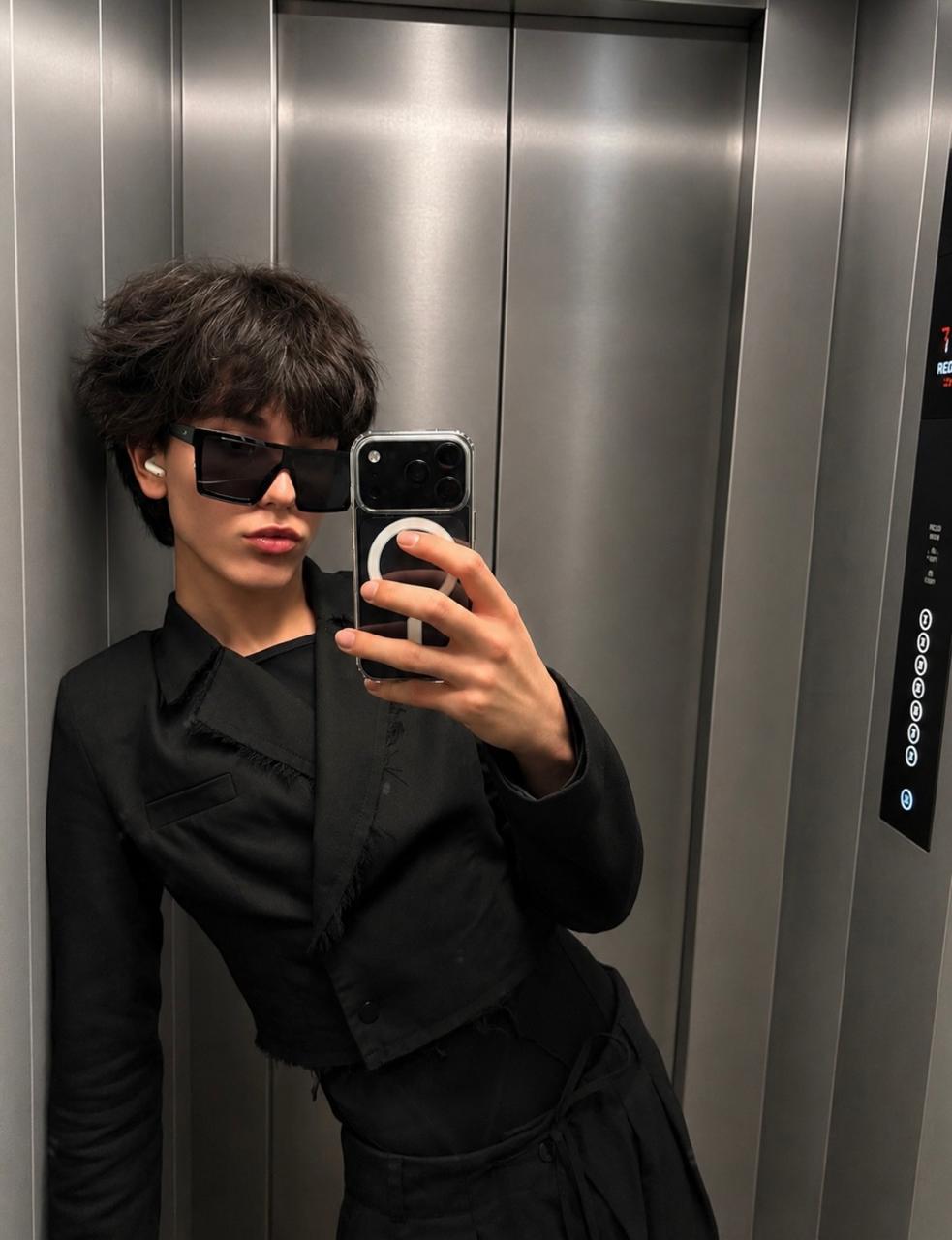 Twink of Swords wearing a black shirt and sunglasses